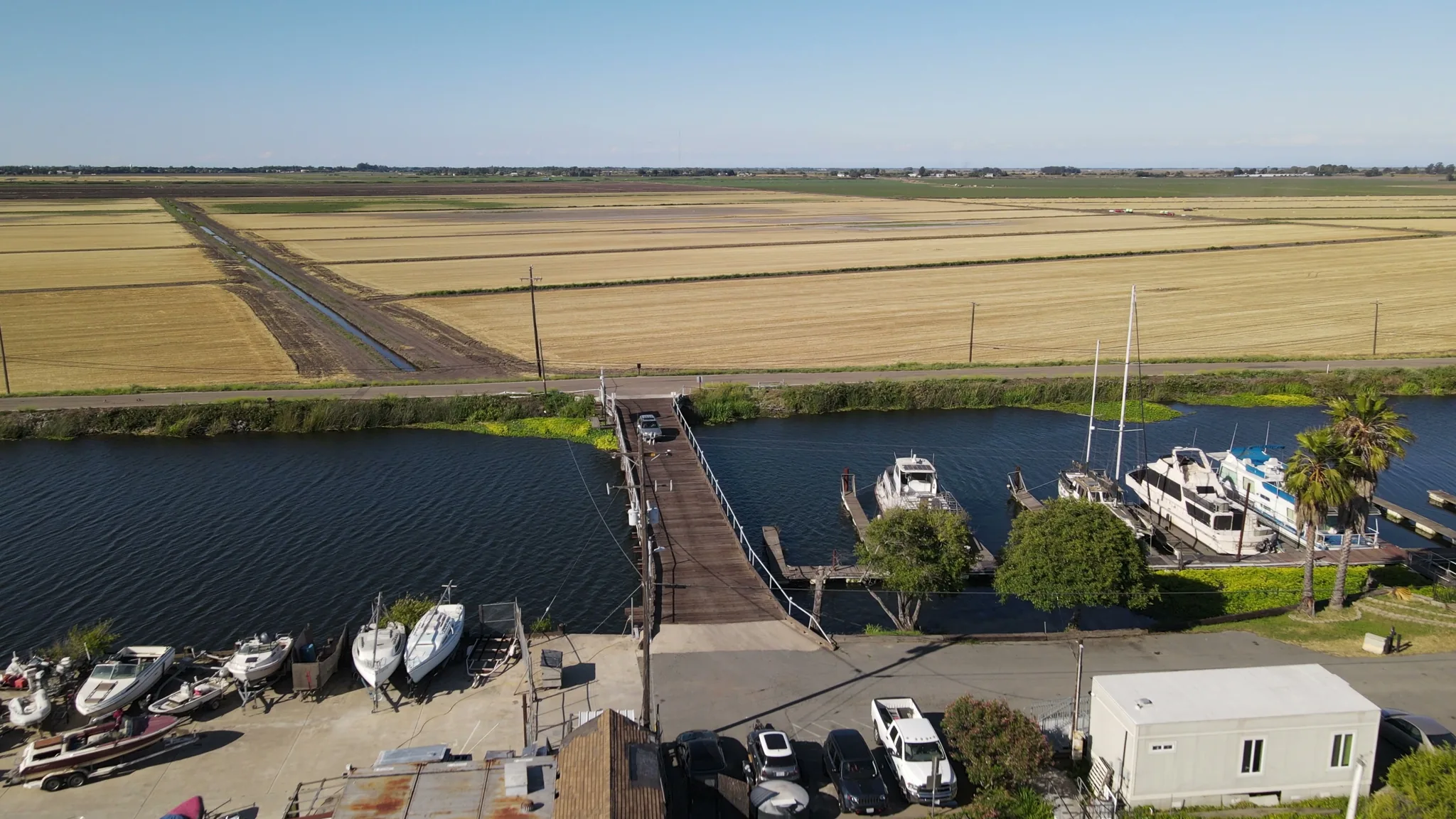 Aerial view of Brother's Island Marina — boats, docks, bridge